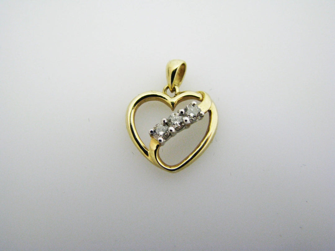 c130 Beautiful 10k Gold Heart Pendant with a Ribbon of 3 Diamonds Across