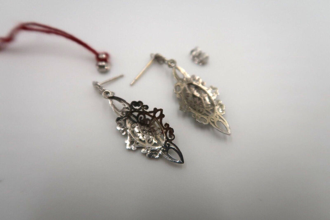 For sale: (1) t260 Pretty Pair of 14kt White Gold Filigree earrings