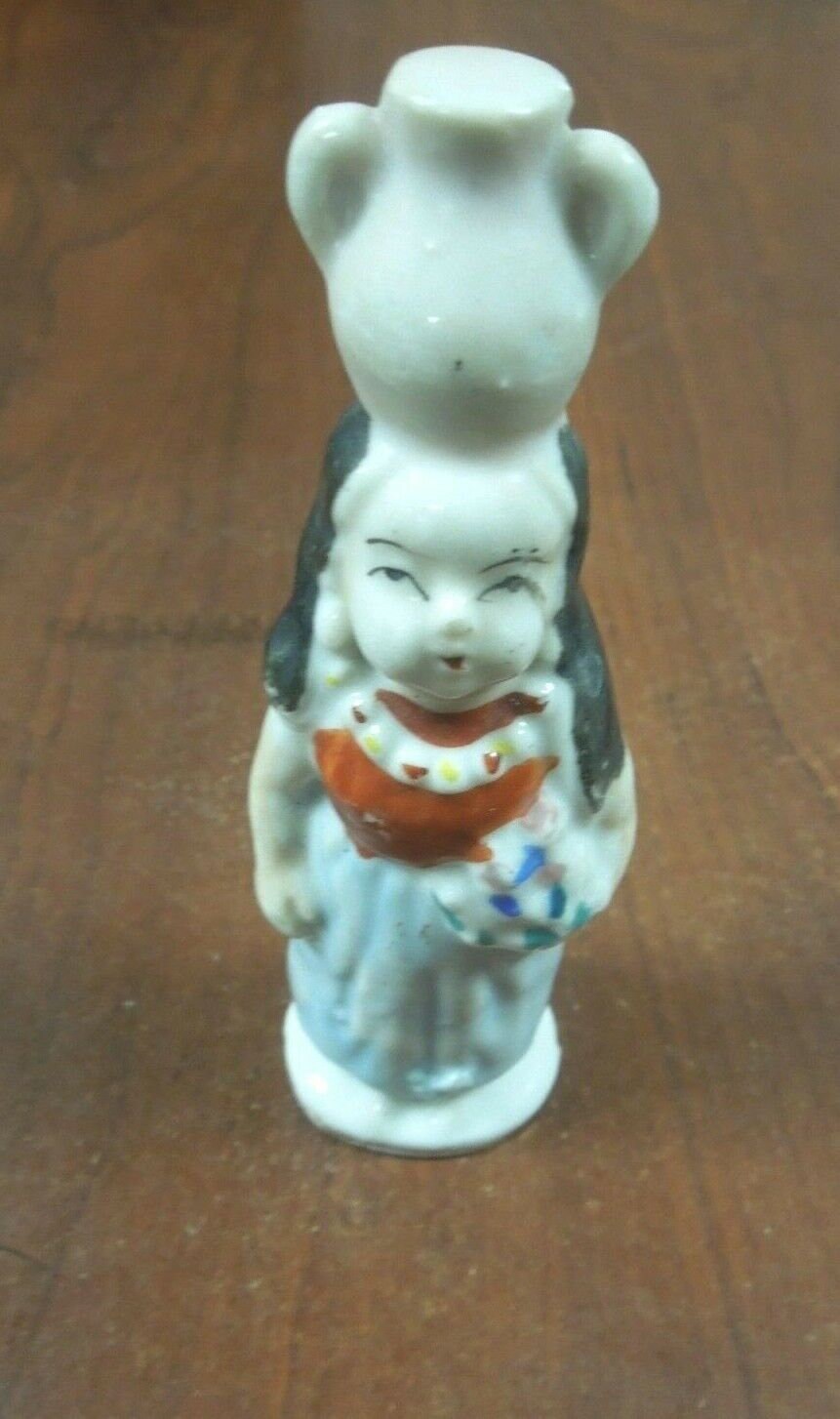 r102 Made In Japan ceramic figurineWomen holding vase on Head Rare Collectibles