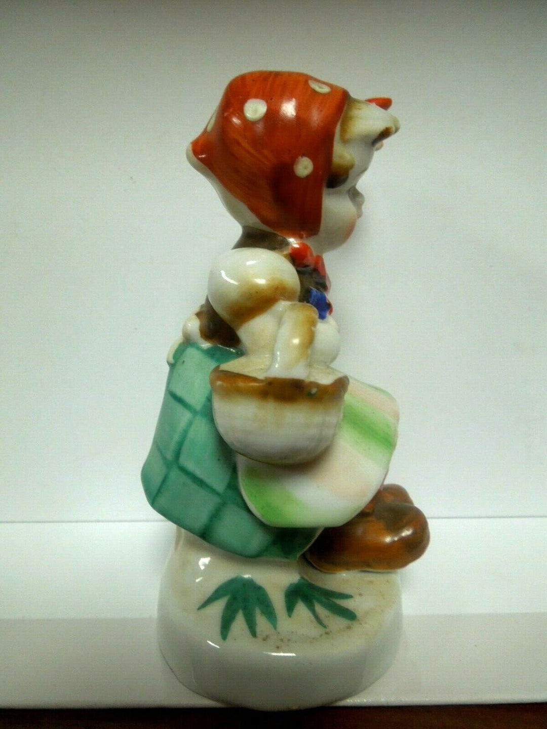 r099 Occupied Japan ceramic figurine, little girl sitting on mushroom scarf & basket