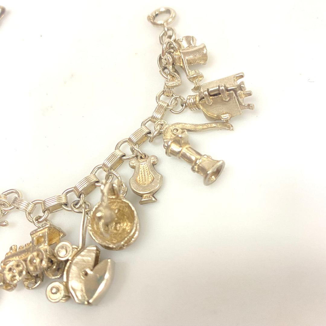 j848 Vintage Sterling Silver Chain Bracelet with multiple Various Charm Pendants