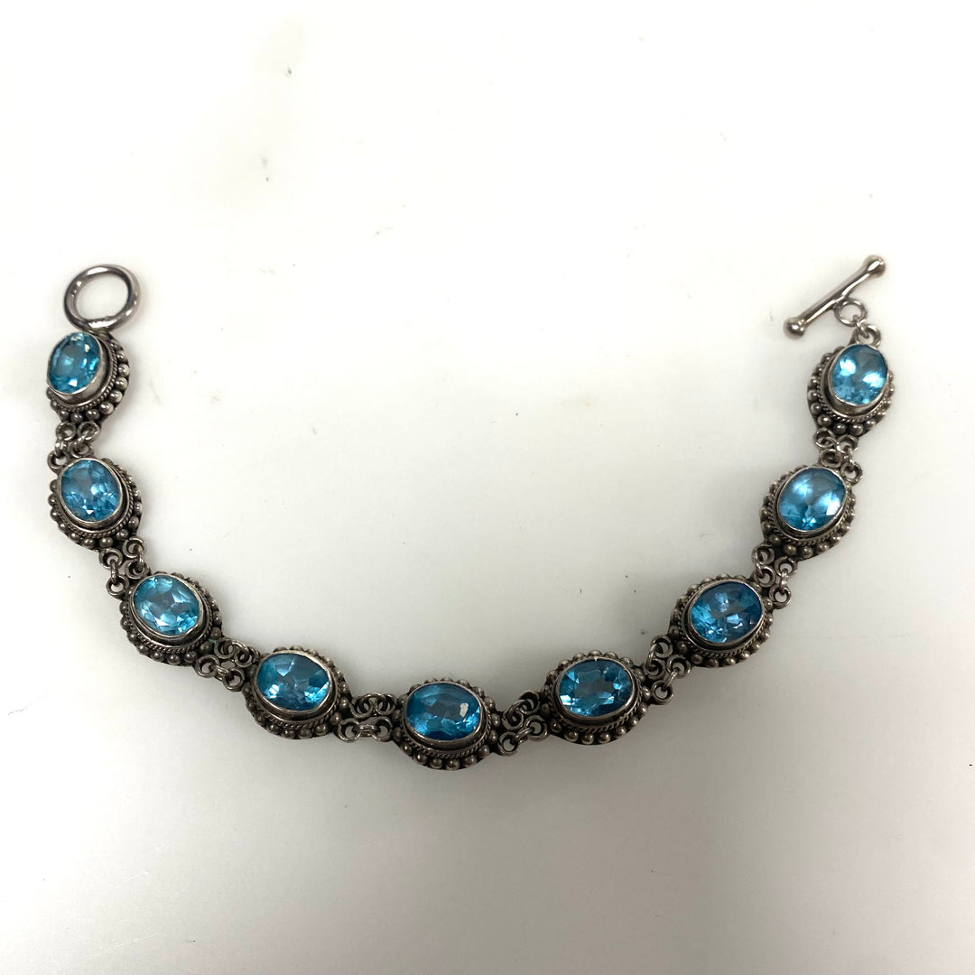 m879 Vintage Artisan Suarti Bali Sterling Silver Oval Blue Topaz Toggle Bracelet
