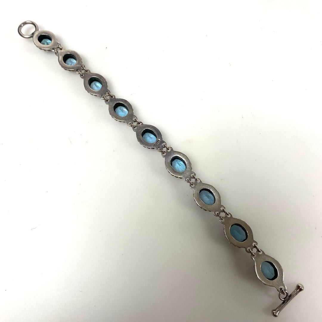 m879 Vintage Artisan Suarti Bali Sterling Silver Oval Blue Topaz Toggle Bracelet