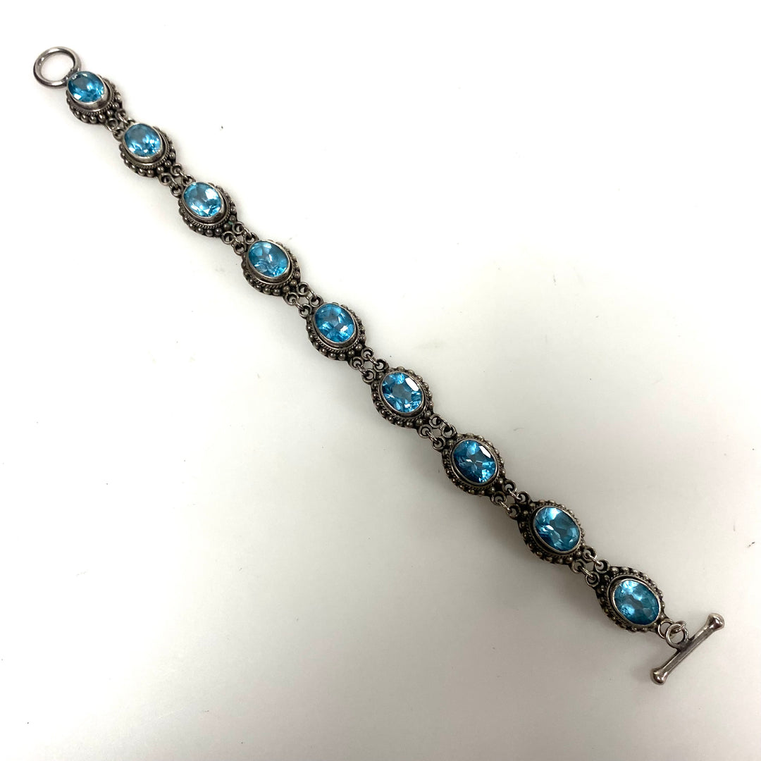 m879 Vintage Artisan Suarti Bali Sterling Silver Oval Blue Topaz Toggle Bracelet