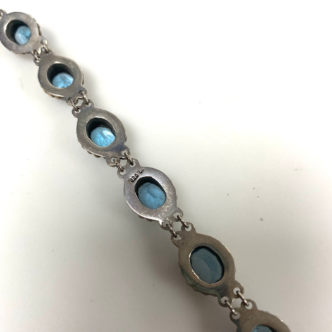 m879 Vintage Artisan Suarti Bali Sterling Silver Oval Blue Topaz Toggle Bracelet