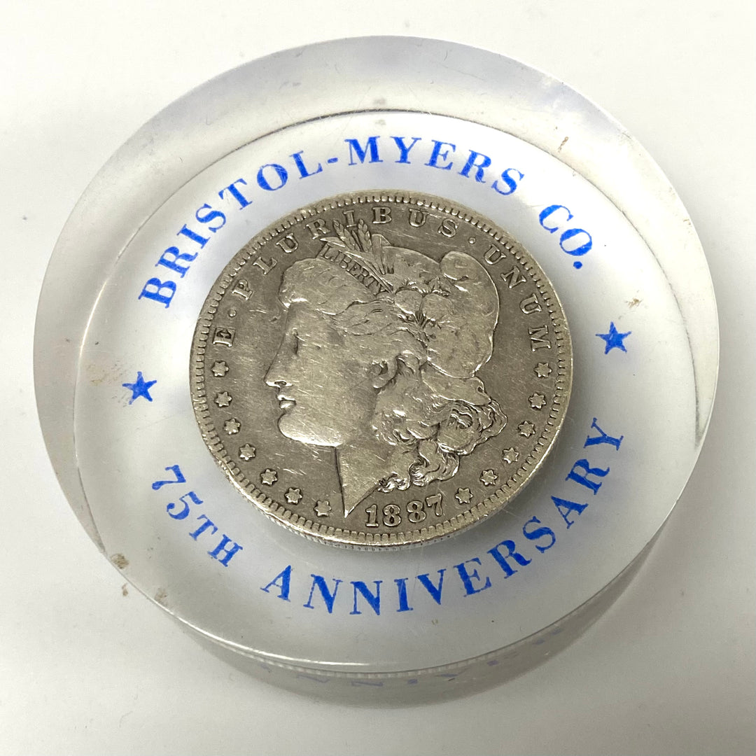v375 Bristol-Myers Morgan 1887 Silver Dollar Lucite 75th Anniversary Paperweight
