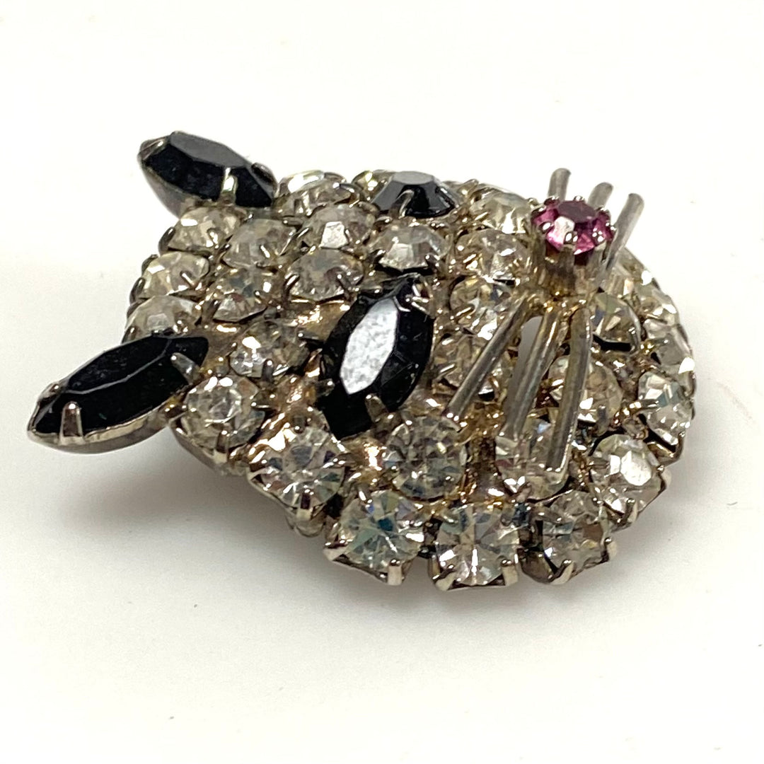 v493 Vintage rhinestone cat face brooch with clear and black crystals pink nose