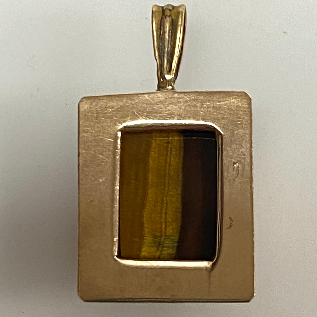 v873 Vintage 10k Yellow Gold Pendant Tiger's Eye Gemstone Carved with Intaglio Profile intaglio profile of a Roman soldier or centurion