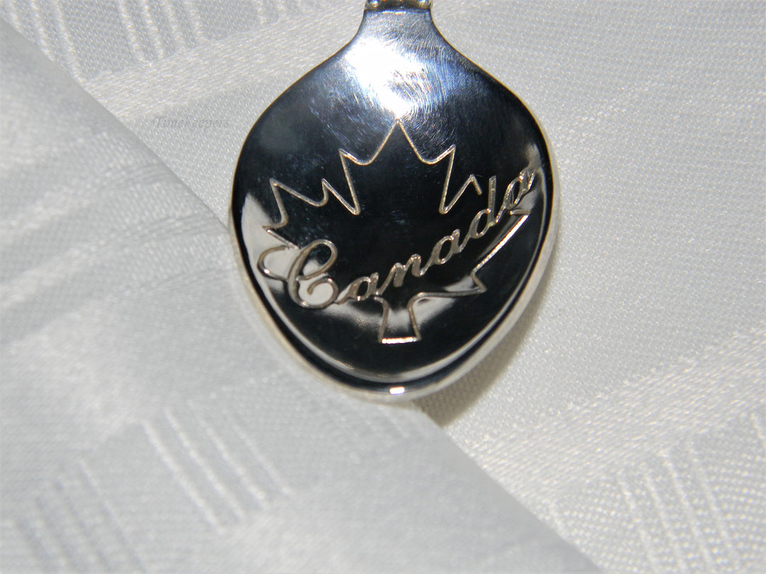 j677 Nice Preowned Stainless Steel Collector Spoon from Canada