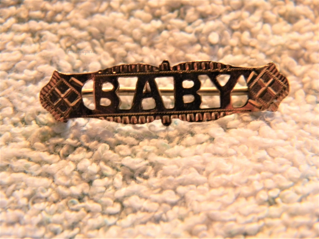 j733 Pretty Vintage Gold Filled Brooch embossed with the Word Baby