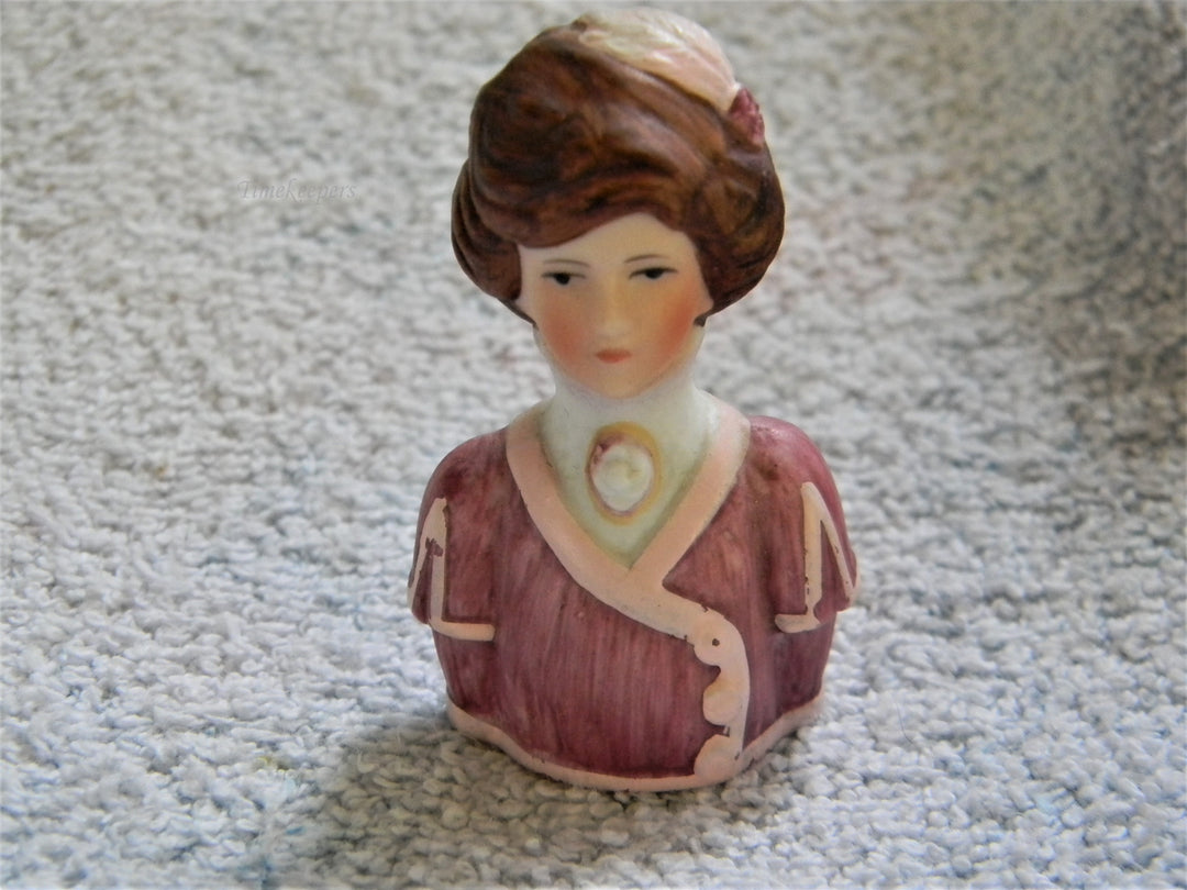 j807 Beautiful Avon 1982 Lady in Pinks with Feathers in Her Hair Bisque Thimble