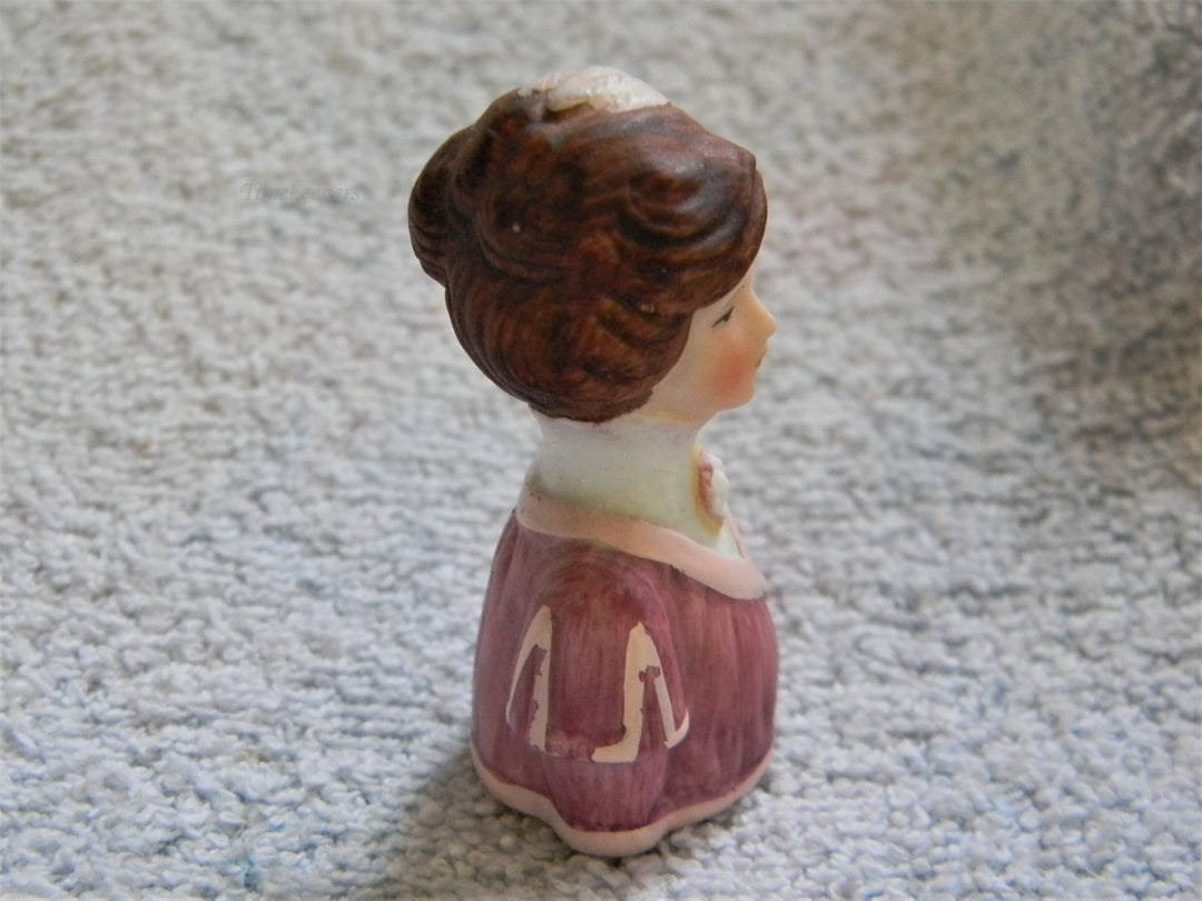 j807 Beautiful Avon 1982 Lady in Pinks with Feathers in Her Hair Bisque Thimble