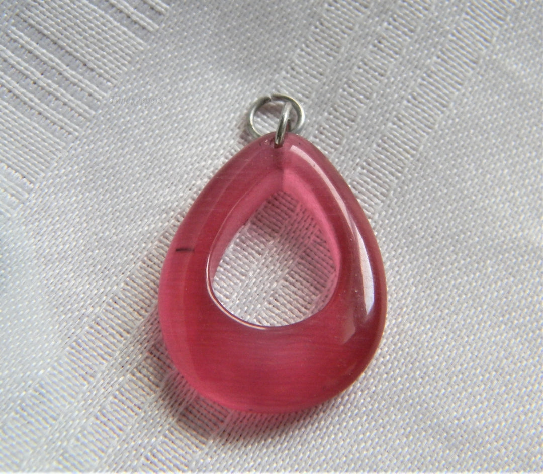 p062 Beautiful Unique Pink Resin Tear Drop shaped Pendant in Silver Tone
