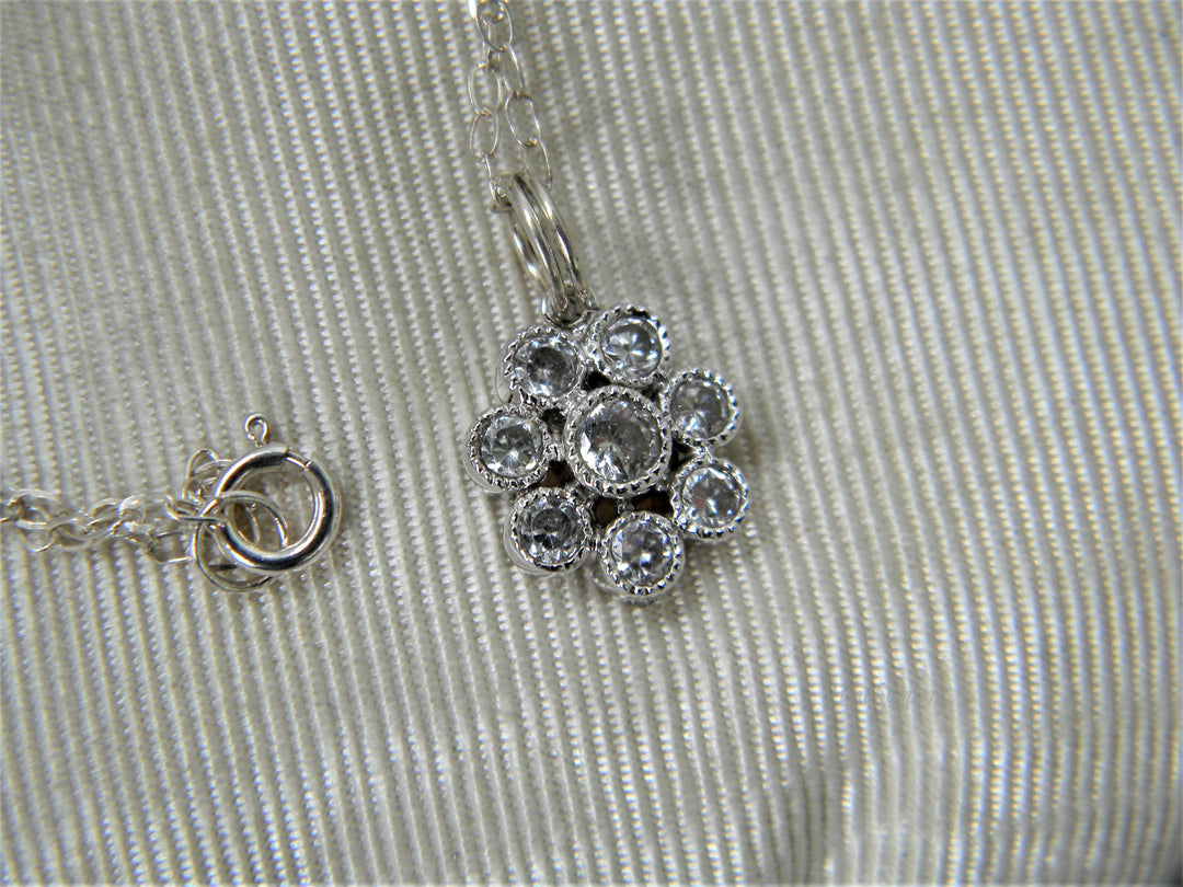 j307 Pretty Little Flower Pendant with Crystals in Sterling Silver on Chain