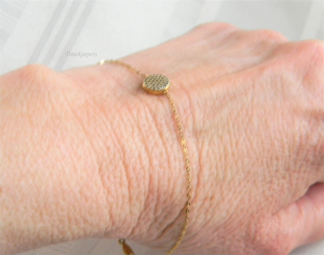 p237 Lovely Gold Tone Rolo Chain Bracelet with Small Medallion Covered with CZ