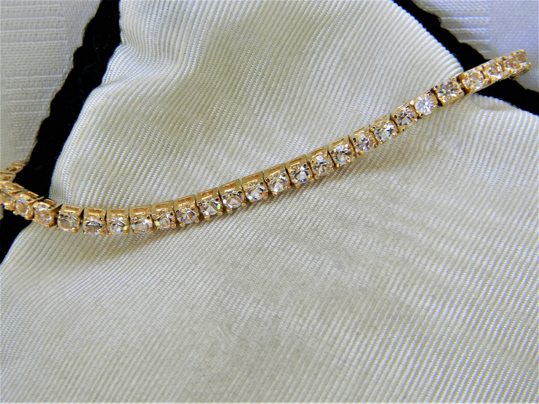 j356 Lovely Gold Tone Tennis Bracelet with Clear Stones