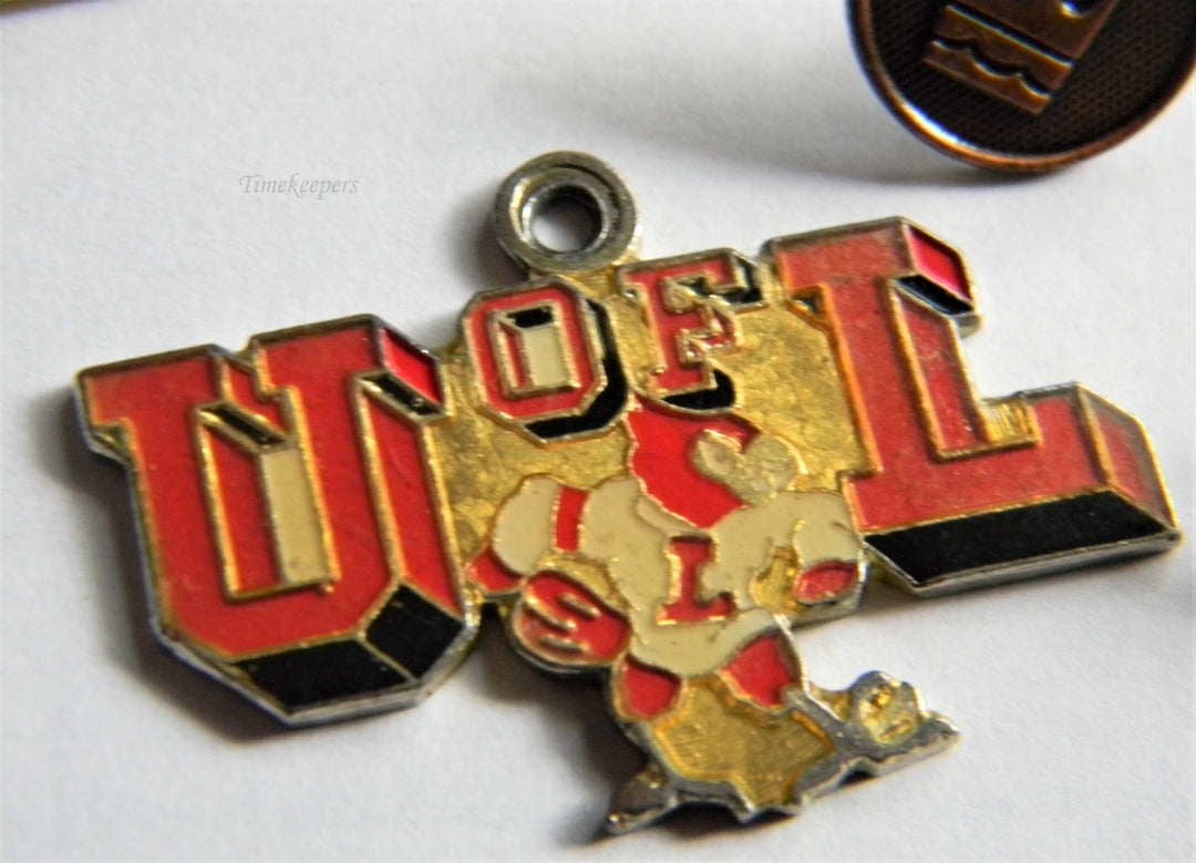 p313 Lot of Eight Lapel Pins Airplane Tie Tac and U of L Pendant