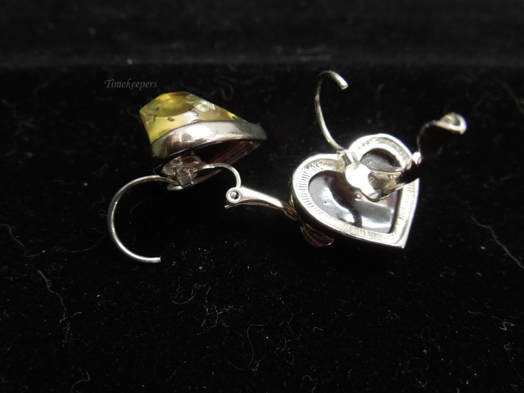 k570 Ladies Unique Silver Tone Heart Shaped Dangle Earrings