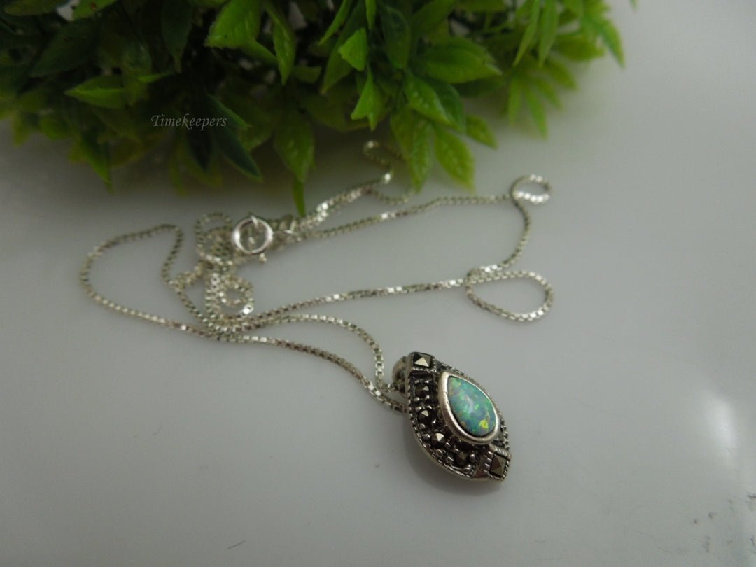 q109 Ladies Sterling Silver Chain 18.5" with an Opal and Marcasite Pendant