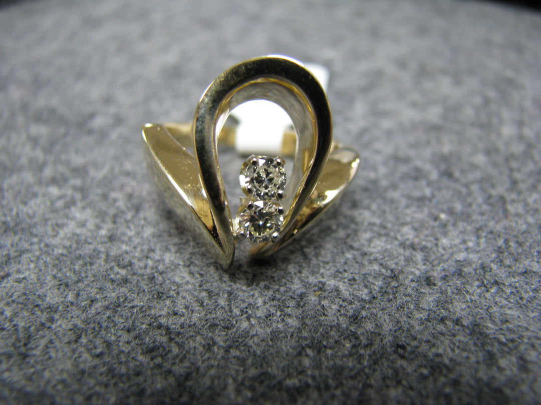 b243 Uniquely Shaped 14kt Diamond ring