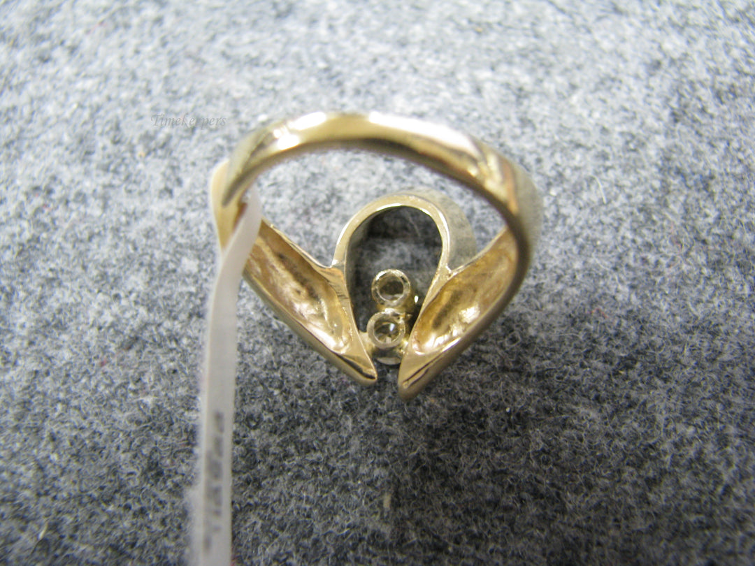 b243 Uniquely Shaped 14kt Diamond ring