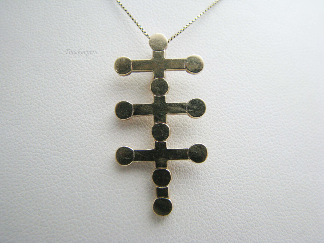 b402 Uniquely designed 14kt Yellow Gold Cross Pendant on a 10kt Yellow Gold chain
