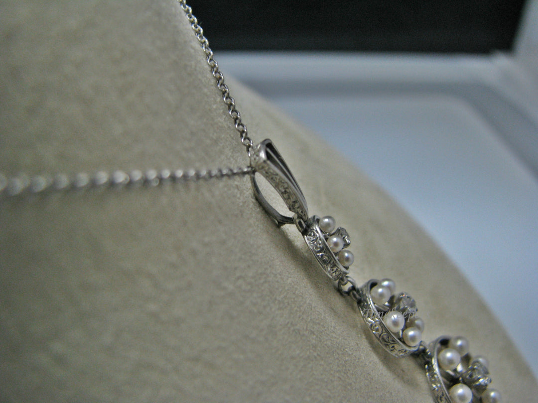 H135 Gorgeous Graduated Three Diamond Platinum Necklace with Seed Pearls