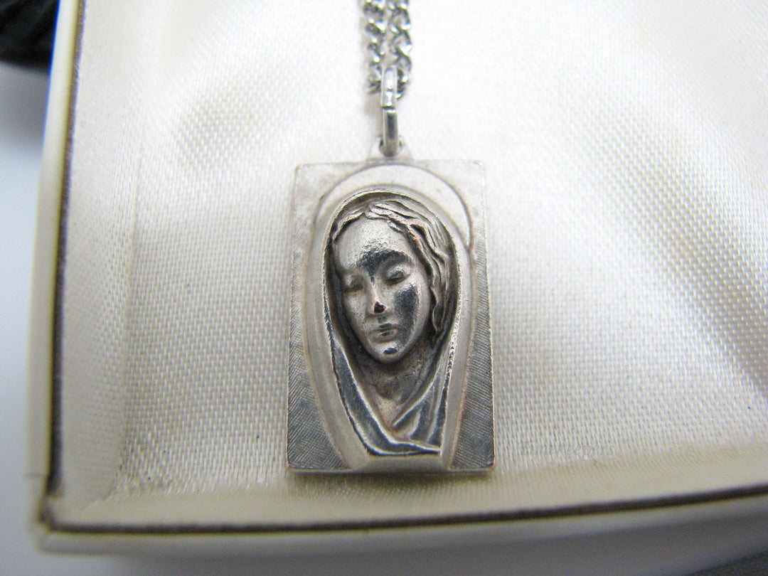 j109 Silver tone Madonna and Jesus Pendant in Original Box