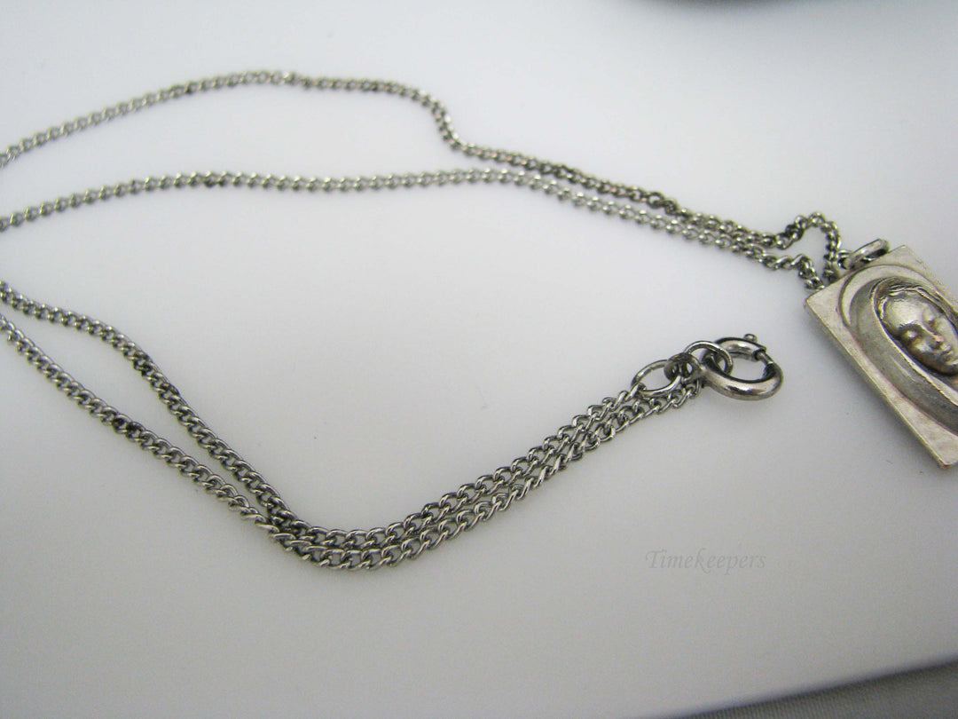 j109 Silver tone Madonna and Jesus Pendant in Original Box