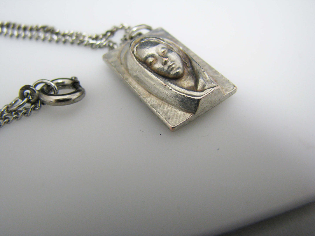 j109 Silver tone Madonna and Jesus Pendant in Original Box