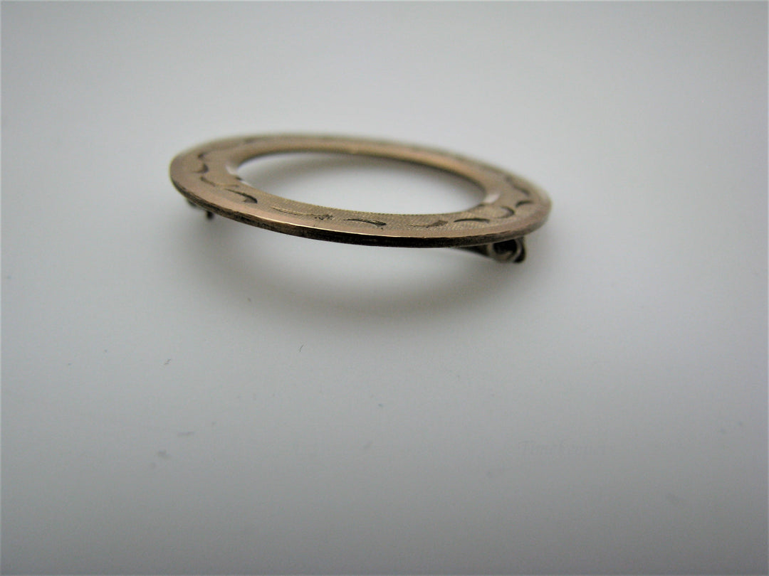 j209 Pretty LaMode Gold Filled Circle Brooch embossed with a Design