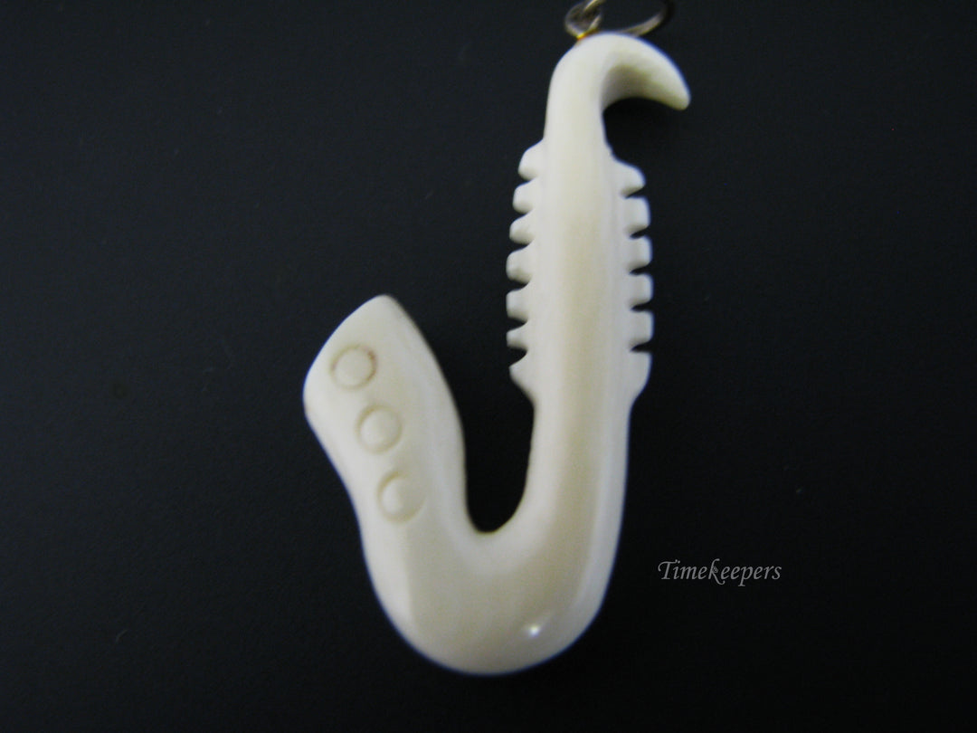 c673 Vintage Carved Bone Saxaphone Pendant/ Charm