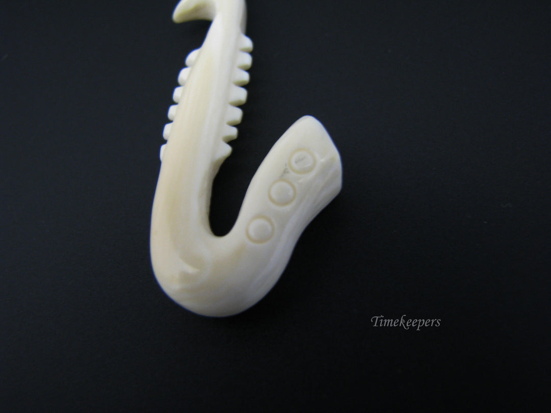 c673 Vintage Carved Bone Saxaphone Pendant/ Charm