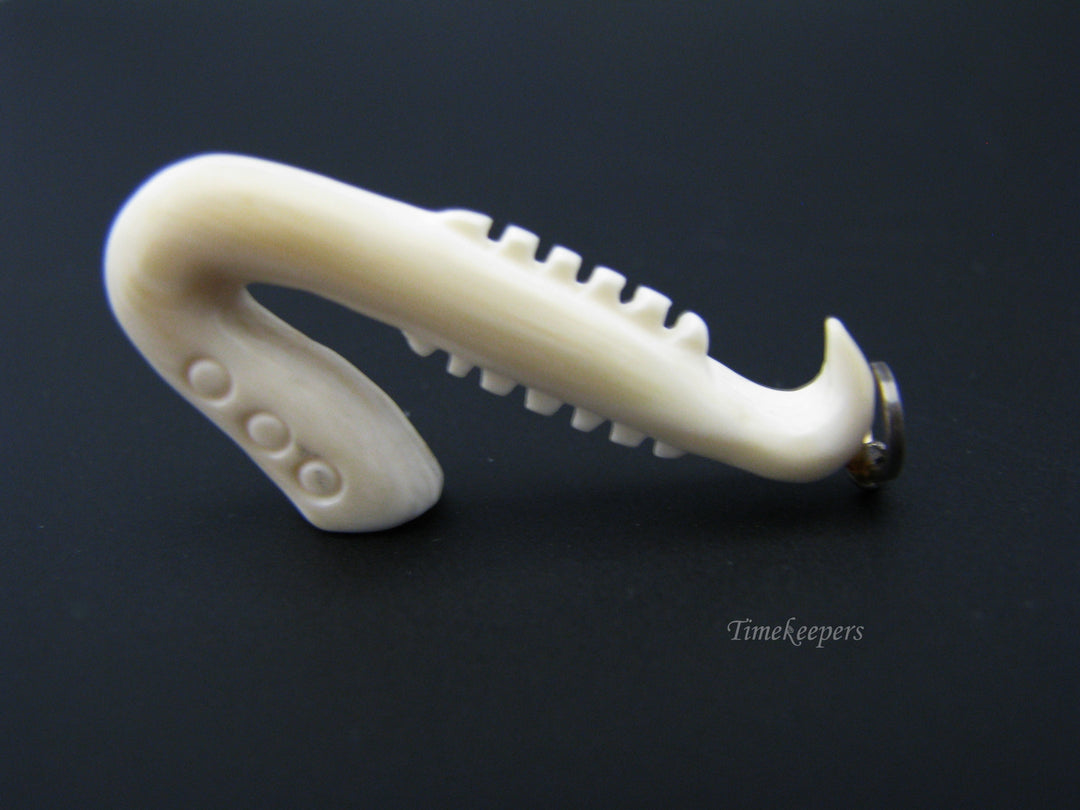 c673 Vintage Carved Bone Saxaphone Pendant/ Charm