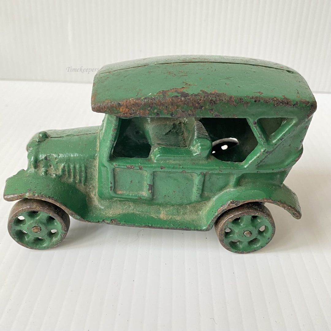 m105 Vintage Collectible Figurine Cast Iron Car Green Paint Rolling Wheels