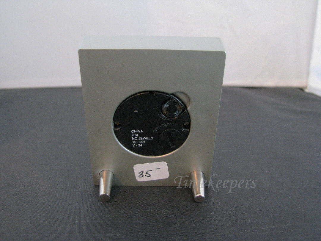 c134 Nice Desk Miniature Clock in a Silver tone Resin with Brown Plastic Gems