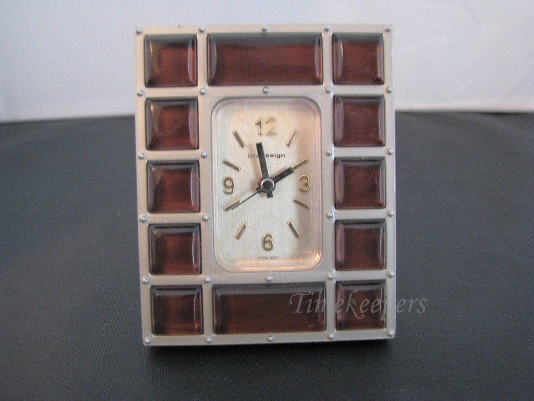 c134 Nice Desk Miniature Clock in a Silver tone Resin with Brown Plastic Gems