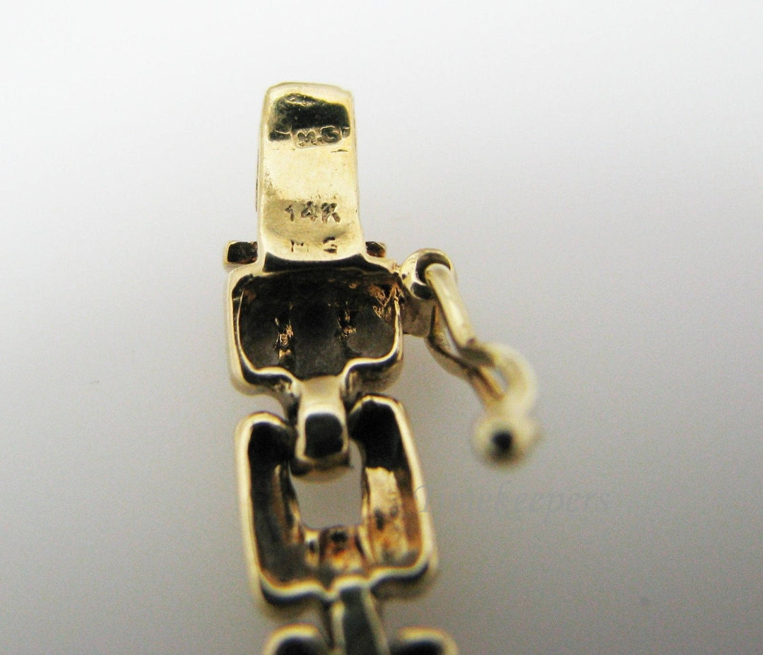 a401 14k Yellow Gold Bracelet with Emerald Cut Gemstones