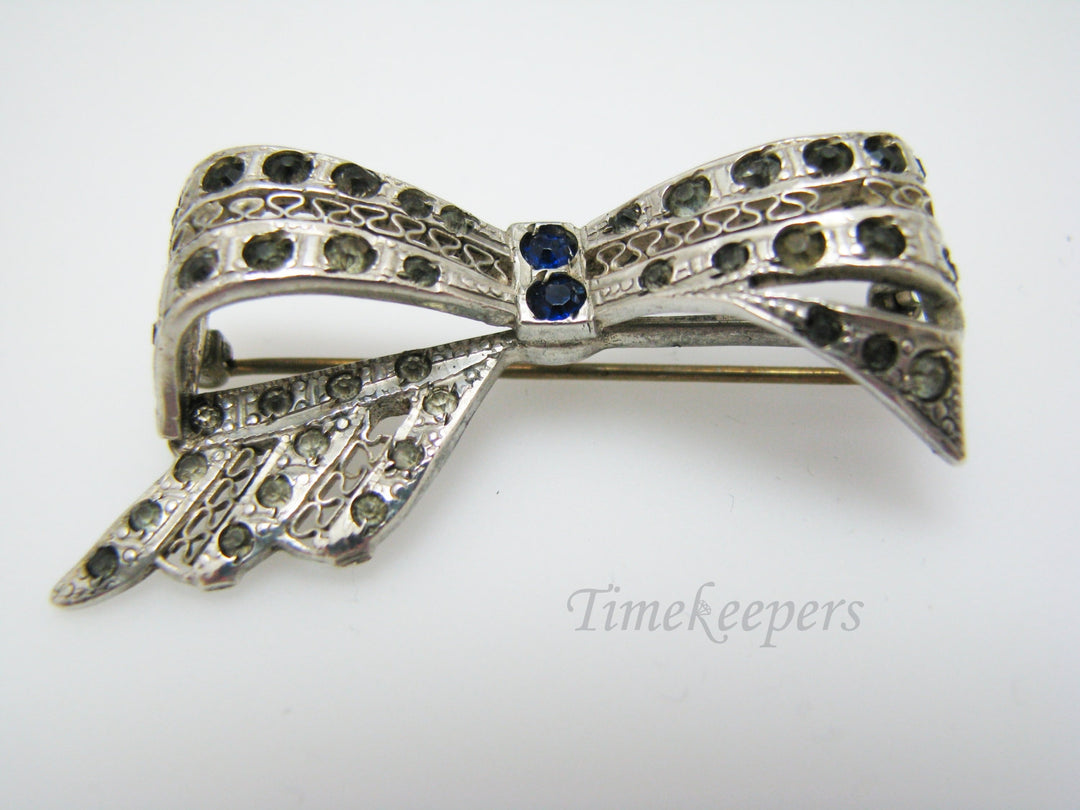 a913 Unique Vintage Bow Brooch in Sterling Silver with Blue & White Stones