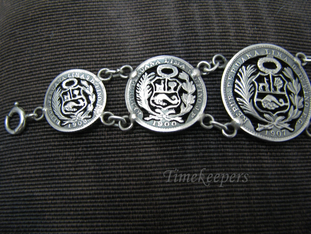 j147 Lovely Peru Cut Out Graduated Coin Bracelet