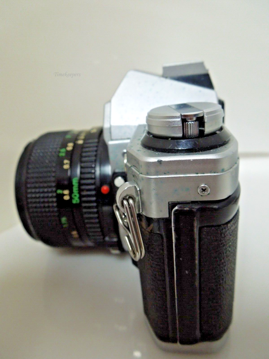 s606 Canon AE-1 35mm SLR w/50mm 1:1.4 and Manual Booklet